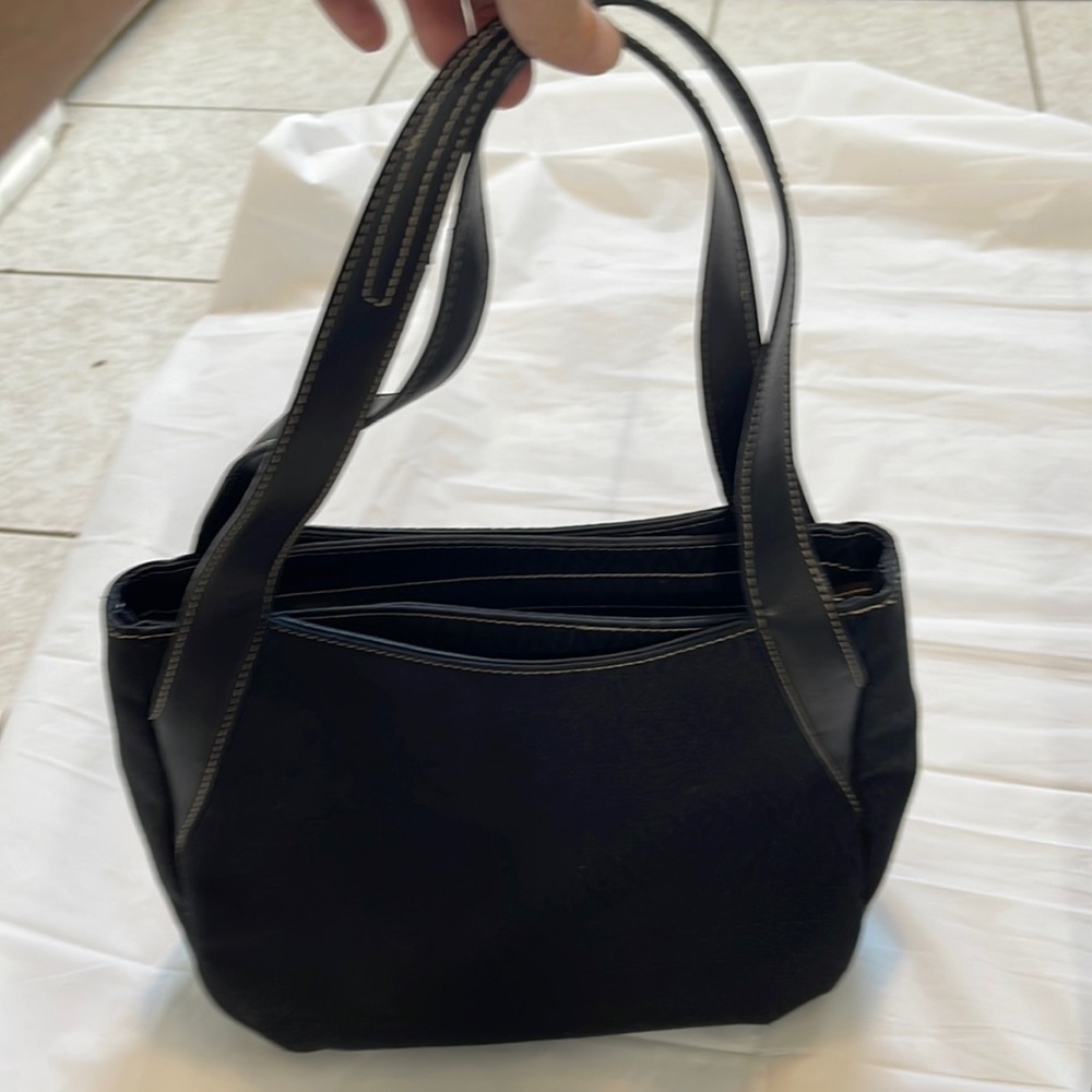 A Line women’s black handle pocket book